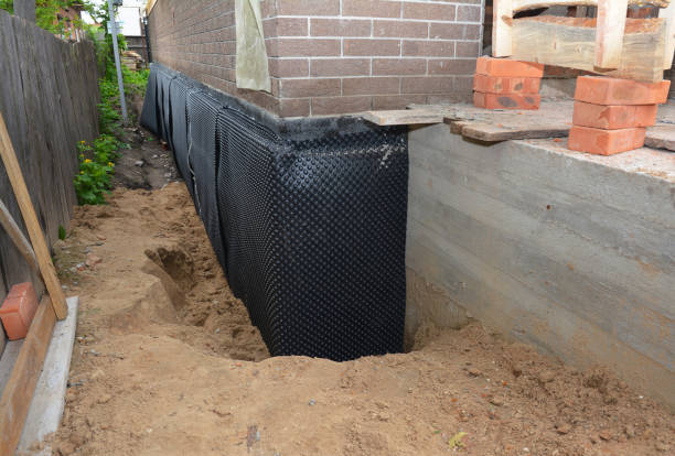 Happy homeowners after waterproofing job in Lynchburg